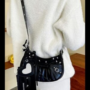 Sleek Black Crossbody Bag with Glossy Finish